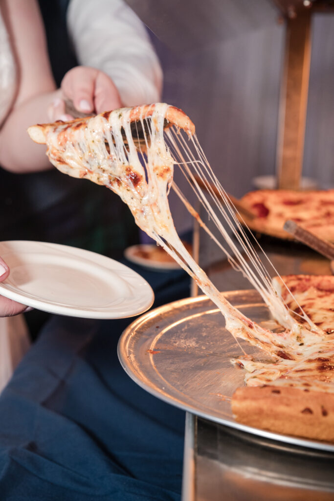 Bride enjoying late night pizza during a Tallmadge Ohio wedding reception