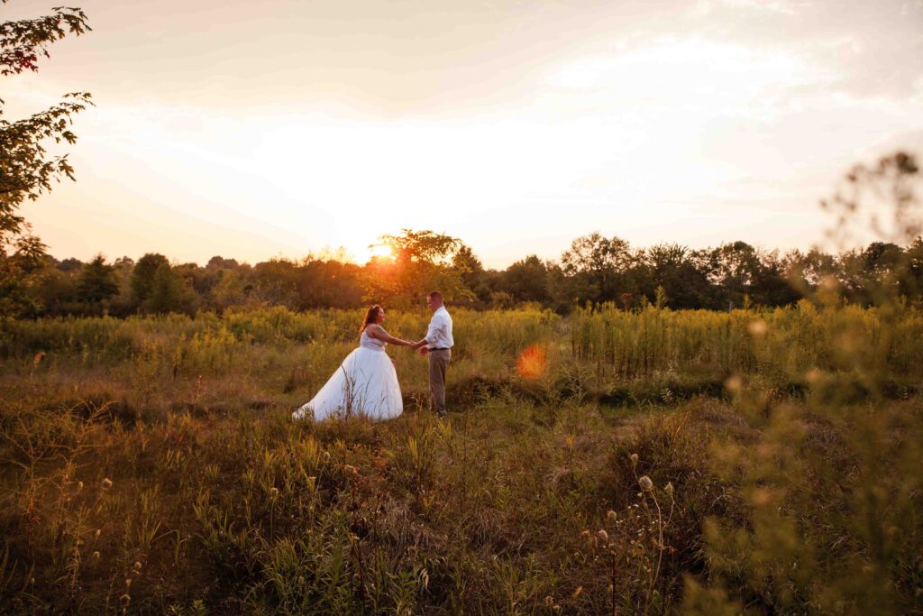 bride and groom walking outside – Akron wedding photographer style