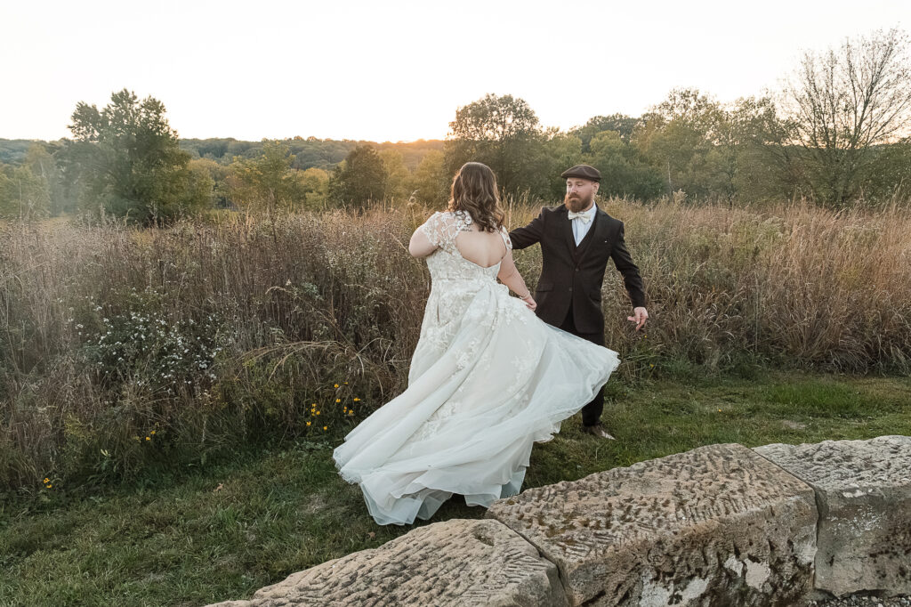 Wedding portraits in the tall grass meadows near Himelright Lodge in Cascade Valley Metro Park
