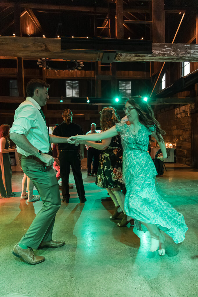 Groom dancing with his mom during the wedding reception inside Himelright Lodge