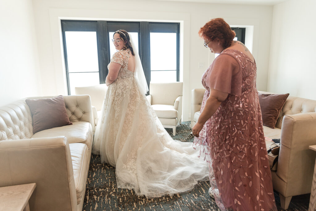 Bride getting final touches with her mom inside the Himelright Lodge wedding suite
