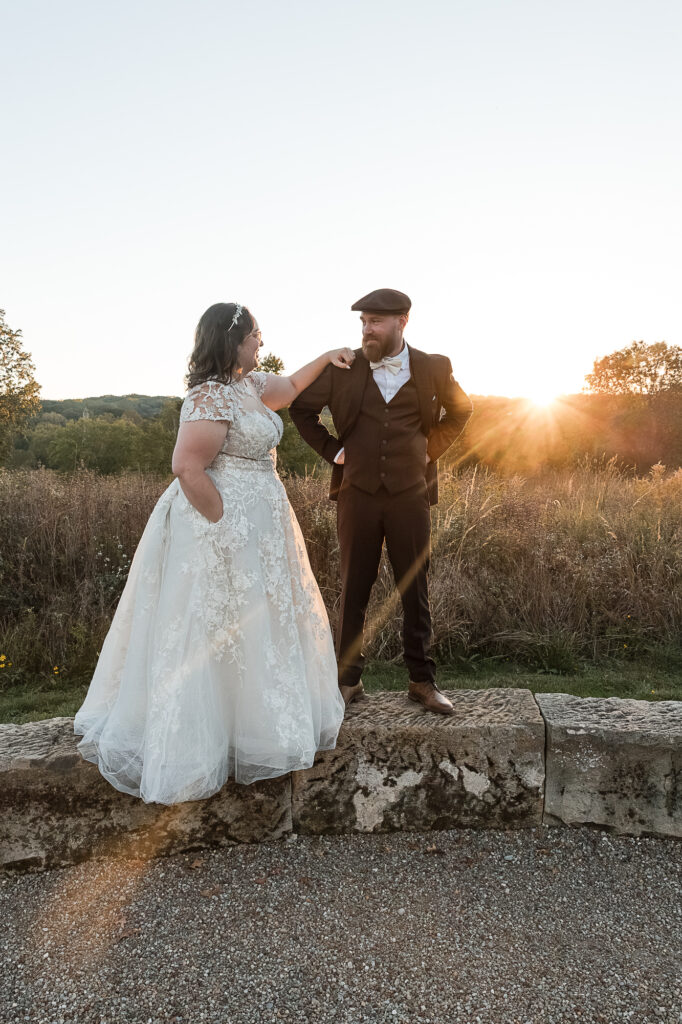 Sunset wedding portraits at Himelright Lodge featuring golden light over the meadows of Cascade Valley Metro Park.